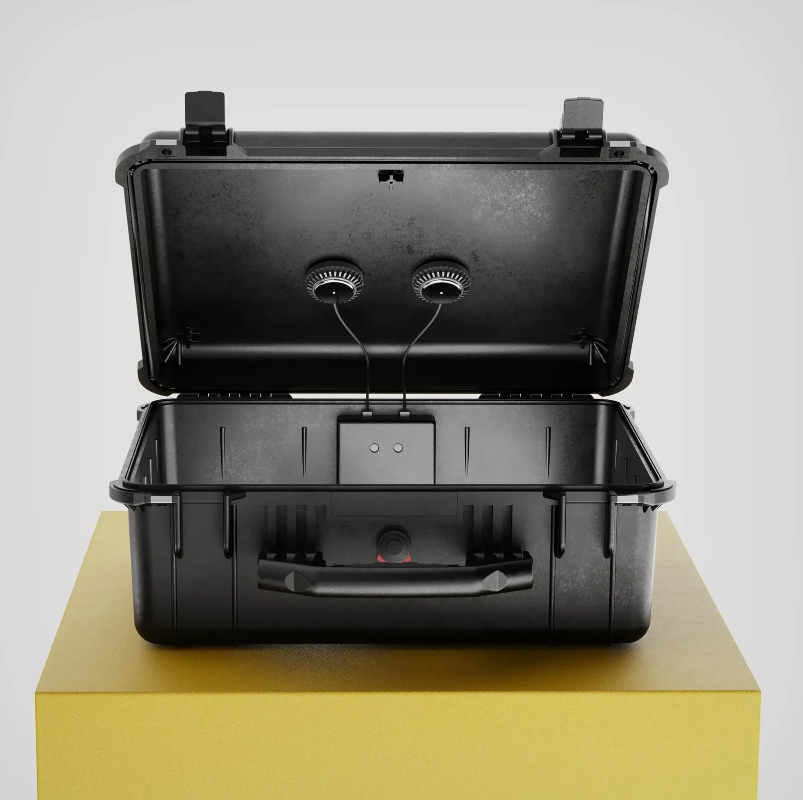 Black Pelican case with Reso 2 installed, lid open, on a yellow studio pedestal