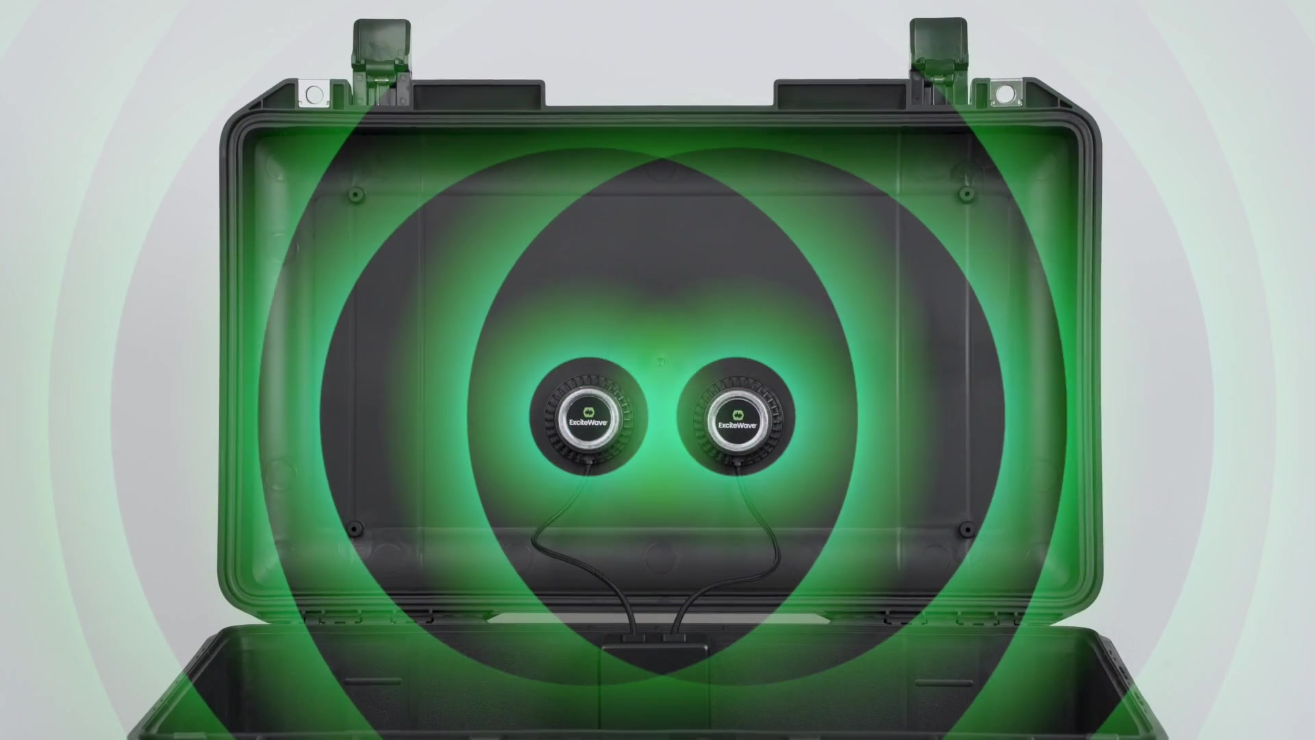 Reso 2 exciters glowing green inside a case lid